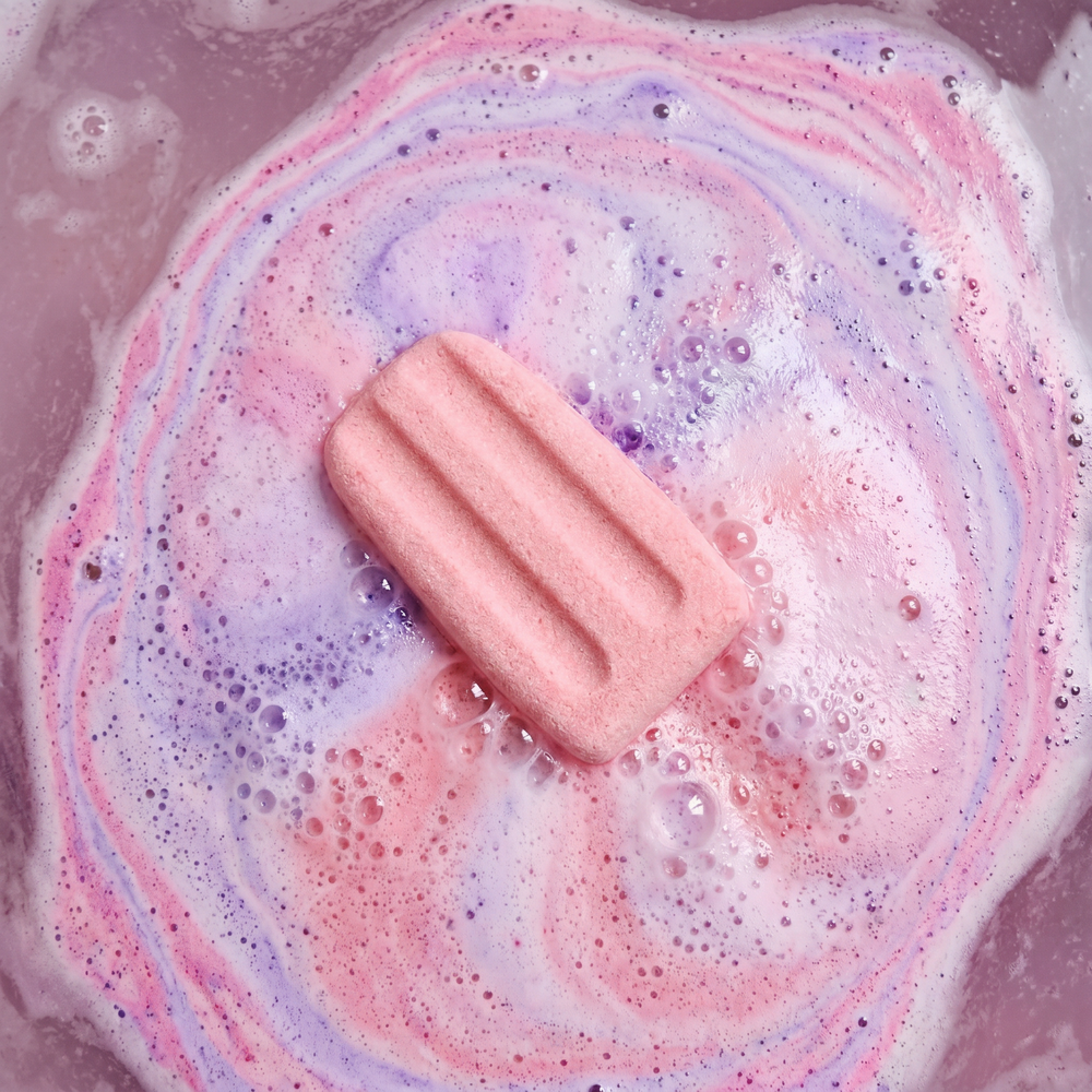 Ice pop bath bomb fizzing in bath water